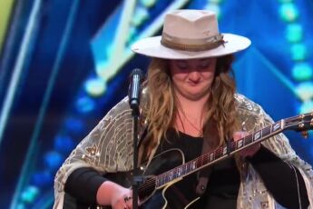 Dani Kerr singing with her guitar on America's Got Talent