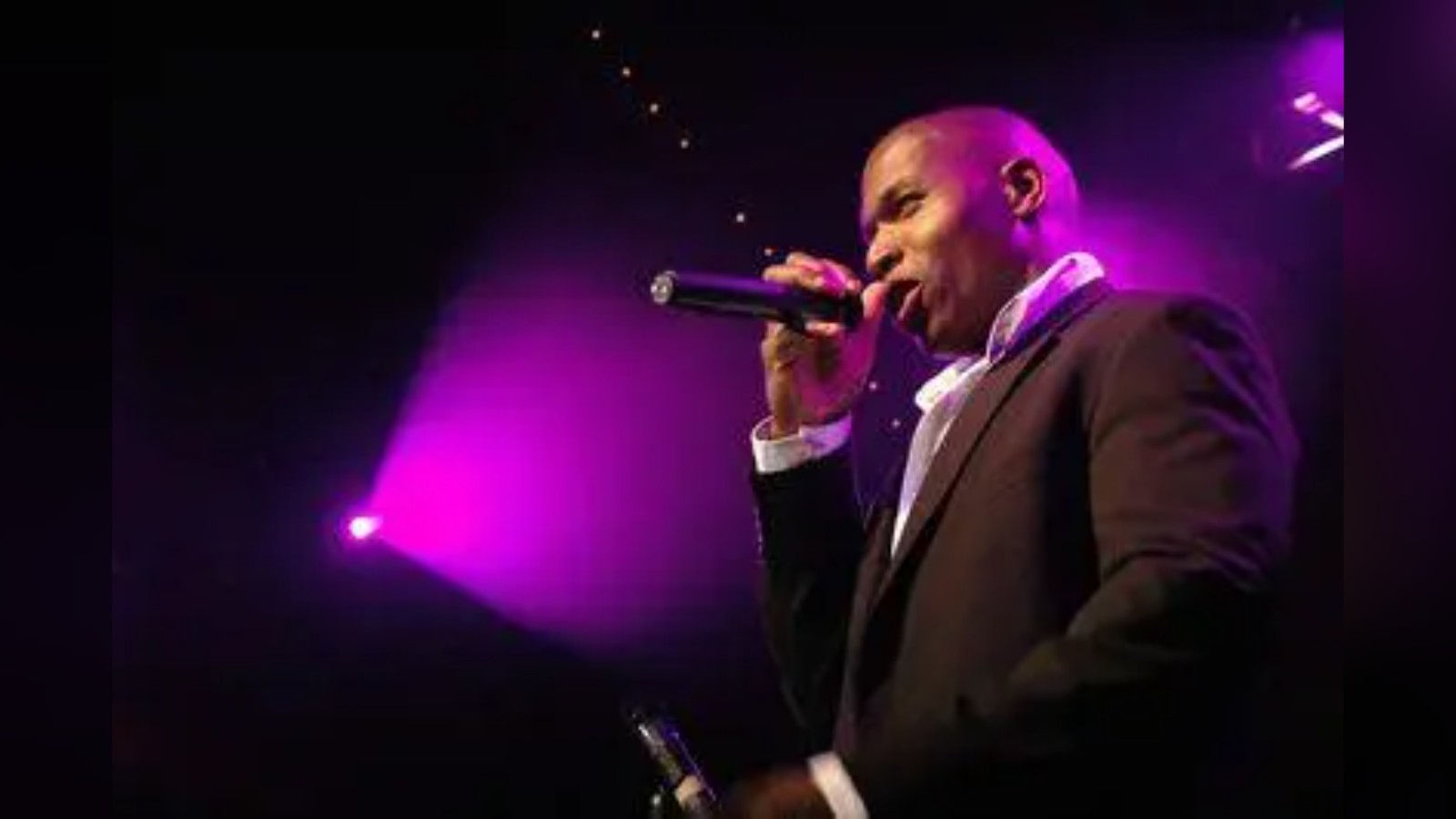 Lawrence Beamen singing on stage