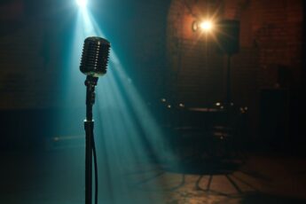 Vintage microphone under a stage spotlight