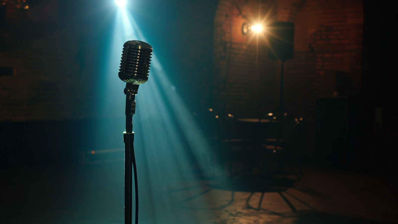 Vintage microphone under a stage spotlight